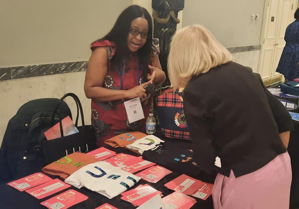 International Workshop on Women & HIV, 12th to 13th April 2024, Washington DC - Estelle raising awareness and explaining UequalsU to an interested participant